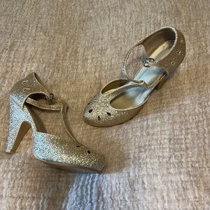 Glittery Gold T Strap heels from Graham Street Shoe Co. sold on ModCloth